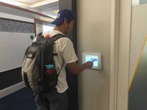 Student booking a study room using LibCal on mounted ipads